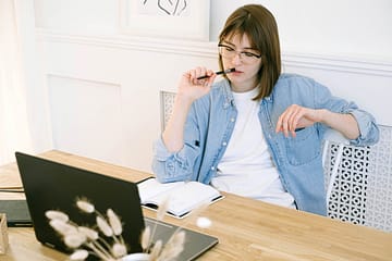 Woman thinking about guest posting